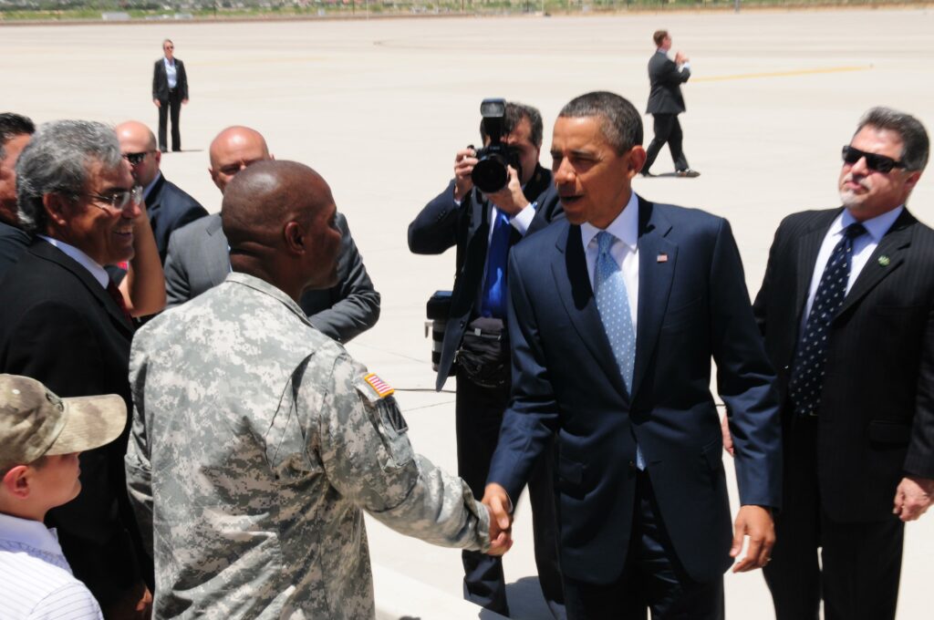 President Obama gives Fort Bliss Commanding General Twitty a challenge coin in El Paso, Texas