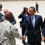 President Obama gives Fort Bliss Commanding General Twitty a challenge coin in El Paso, Texas